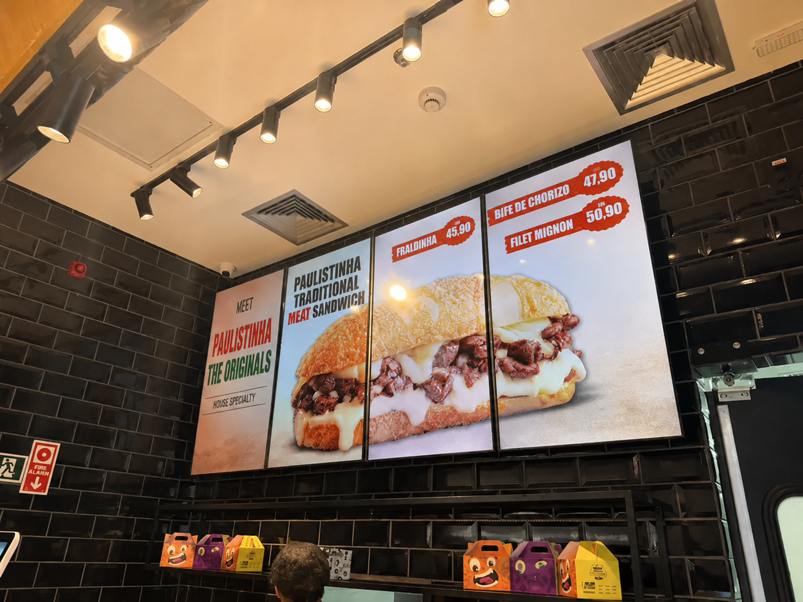 JSMenu customer installation with a sandwich campaign spanning four portrait screens side by side